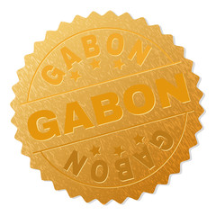 GABON gold stamp reward. Vector golden medal with GABON text. Text labels are placed between parallel lines and on circle. Golden skin has metallic effect.