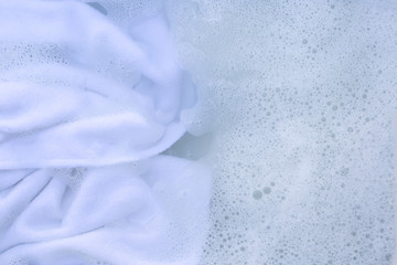 Soak a cloth before washing, white cloth