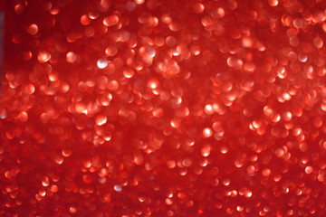 Abstract red sparkling glitter bokeh background