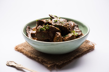 Mutton Liver fry or Kaleji masala, popular Non vegetarian recipe from India and Pakistan. served dry or with curry in a bowl, karahi or plate