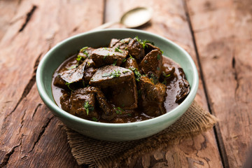 Mutton Liver fry or Kaleji masala, popular Non vegetarian recipe from India and Pakistan. served dry or with curry in a bowl, karahi or plate