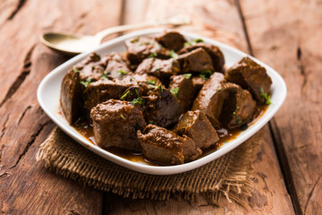 Mutton Liver fry or Kaleji masala, popular Non vegetarian recipe from India and Pakistan. served dry or with curry in a bowl, karahi or plate