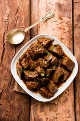Mutton Liver fry or Kaleji masala, popular Non vegetarian recipe from India and Pakistan. served dry or with curry in a bowl, karahi or plate