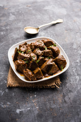 Mutton Liver fry or Kaleji masala, popular Non vegetarian recipe from India and Pakistan. served dry or with curry in a bowl, karahi or plate