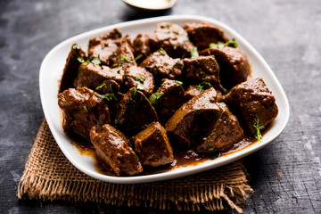 Mutton Liver fry or Kaleji masala, popular Non vegetarian recipe from India and Pakistan. served dry or with curry in a bowl, karahi or plate