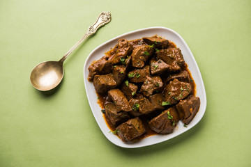 Mutton Liver fry or Kaleji masala, popular Non vegetarian recipe from India and Pakistan. served dry or with curry in a bowl, karahi or plate