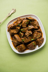 Mutton Liver fry or Kaleji masala, popular Non vegetarian recipe from India and Pakistan. served dry or with curry in a bowl, karahi or plate