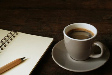 A cup of coffee on working table.