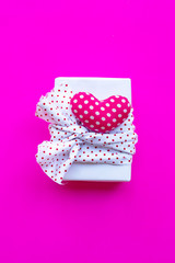 Valentine's heart with gift box  on pink background