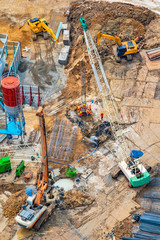 Aerial view of site preparation and construction in progress.