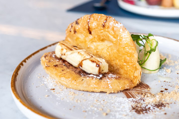 Delicious Roti and Nutella on the plate in restaurant, elegant dessert.