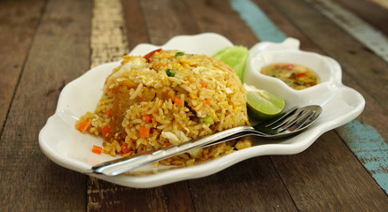 Shrimp fried rice serving with fresh vegetable on white  plate
