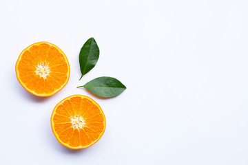 Fototapeta na wymiar Fresh orange citrus fruits with leaves on white background.
