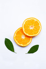 Fresh orange citrus fruits with leaves on white background.