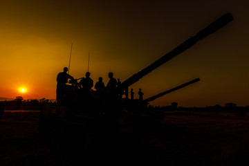 twilight landscape silhouette military and cannons