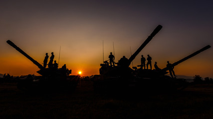 twilight landscape silhouette military and cannons