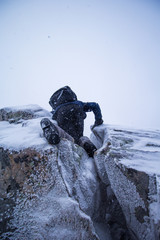 climber climbs the icy mountain