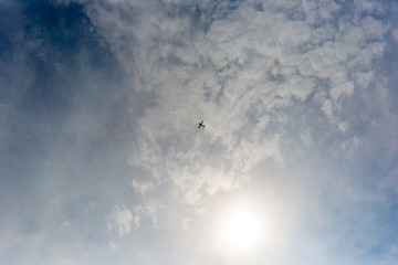 Cessna flying high above the sun on a beautiful summers day. The atmosphere has come alive with activity, different people operating the airways and now the stars.