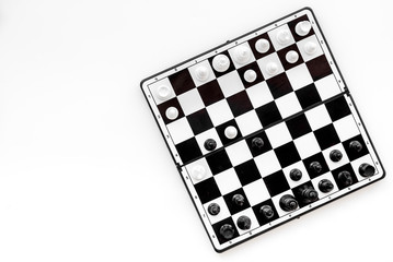 Chess game concept. Chess board with figures on white background top view space for text