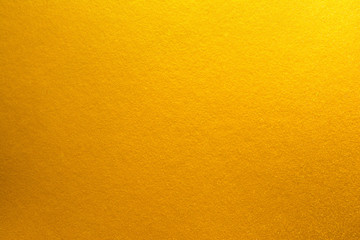 Orange gold color texture background. Yellow bright gold texture surface