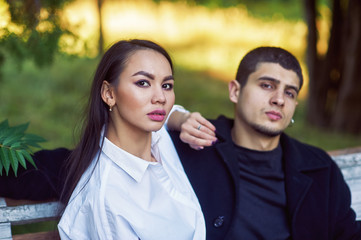 Multi-ethnic couple in love on a walk in the Park