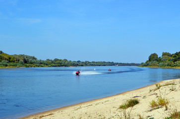 Fototapeta na wymiar Riding a jet ski on the Oka River near the village of Lanshinsky 
