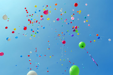 Multicolored balloons against the blue sky
