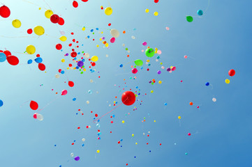 Multicolored balloons against the blue sky
