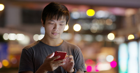 Man use of mobile phone in the street