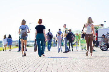 Fototapeta premium group of people walking on city street