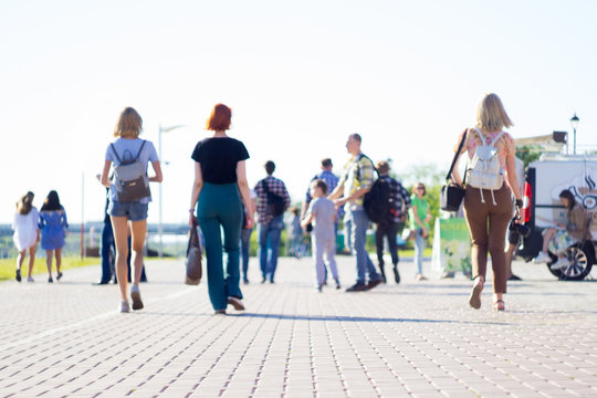 Group Of People Walking On City Street