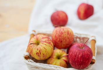 Red apple in wicker basket