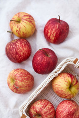 Red apple in wicker basket