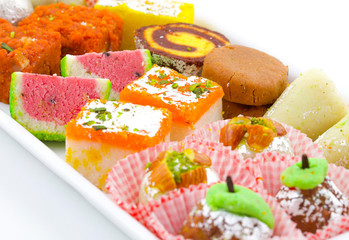 Indian Traditional Mix Sweet Food or Mix Mithai include Peda, Mawa Burfi, Dry Fruits Sweet, Halwa or Coconut Burfi