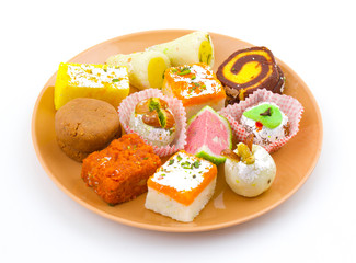 Indian Traditional Mix Sweet Food or Mix Mithai include Peda, Mawa Burfi, Dry Fruits Sweet, Halwa or Coconut Burfi
