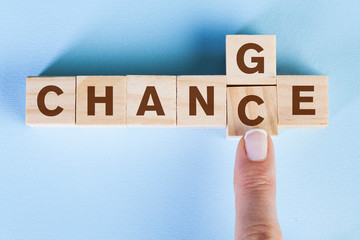 Change concept. Wooden letters on a yellow background © dragonstock
