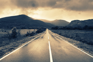 Wet asphalt road at rainy day