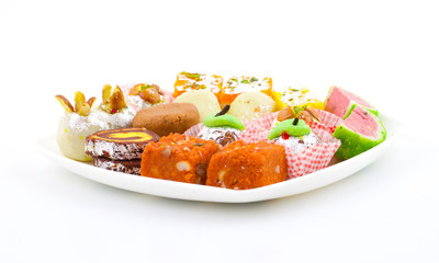 Indian Traditional Mix Sweet Food or Mix Mithai include Peda, Mawa Burfi, Dry Fruits Sweet, Halwa or Coconut Burfi