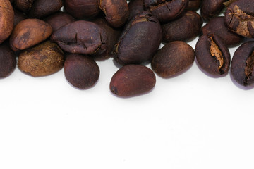 Coffee beans background texture with copy space for text. Royalty high-quality free stock macro photo image of roasted black coffee beans, coffee beans background. Close-up or macro photo coffee bean
