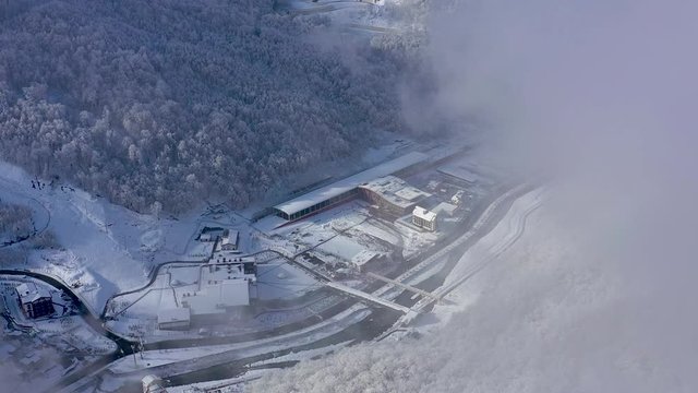 Aerial view of ski resort Gorky Gorod in Caucasus Mountains, Sochi, Russia. Mountain roads from above.