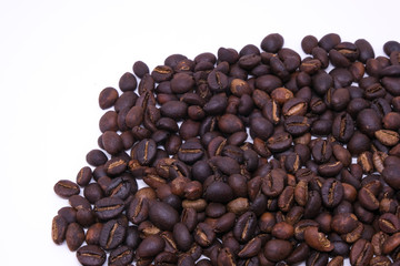Coffee beans background texture with copy space for text. Royalty high-quality free stock macro photo image of roasted black coffee beans, coffee beans background. Close-up or macro photo coffee bean