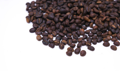 Coffee beans background texture isolated on white background with copy space for text. Royalty high-quality free stock macro photo image roasted brown, black coffee bean isolated on white background