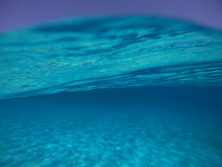 Underwater photo of exotic paradise island bay with turquoise clear sea