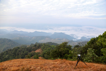 Distant hills and mountains above a sea of fog and mist, the mist in winter Landscape, view from top of mountain at Doi Phu Co, Mae Hong Sorn, Thailand 