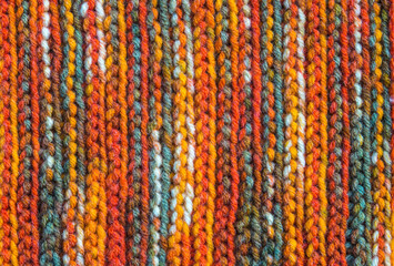 Obraz premium Hand made snug cozy knitting textile background, wool scarf texture