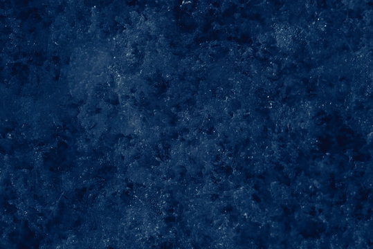 Cold snowy icy blue background. Cold winter weather texture. Snowflakes abstract background