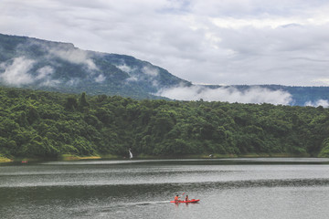 Kayaks in the lake. Tourists kayaking on the Bay of nakornnayok thailand.