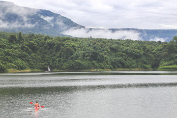 Kayaks in the lake. Tourists kayaking on the Bay of nakornnayok thailand.