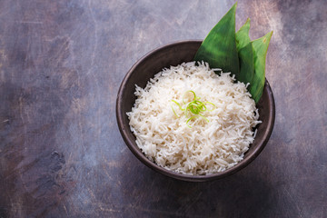 Nasi lemak or Malay fragrant rice cooked in coconut milk and pandan leaf, copy space - 241520698