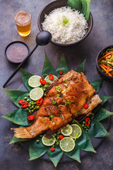 Thai cuisine deep fried fish with salad and rice, top view